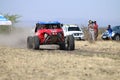 Speeding red Porter rally car front view